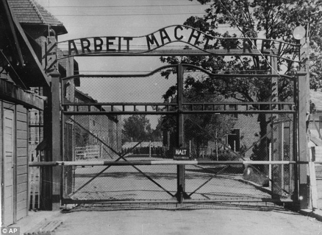 The main gate of the Nazi death camp, where 1.1million people were killed, stated: 