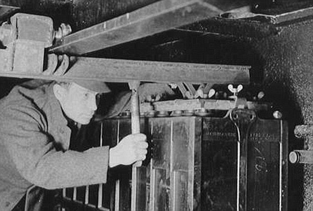 An AFA technician repairing a battery cell in a German type IX boat in 1942. AFA was owned by Gunther Quandt and manufactured batteries and accumulators for the German military